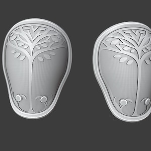 May include: Two white, oval-shaped knee pads with a tree design carved into the surface.