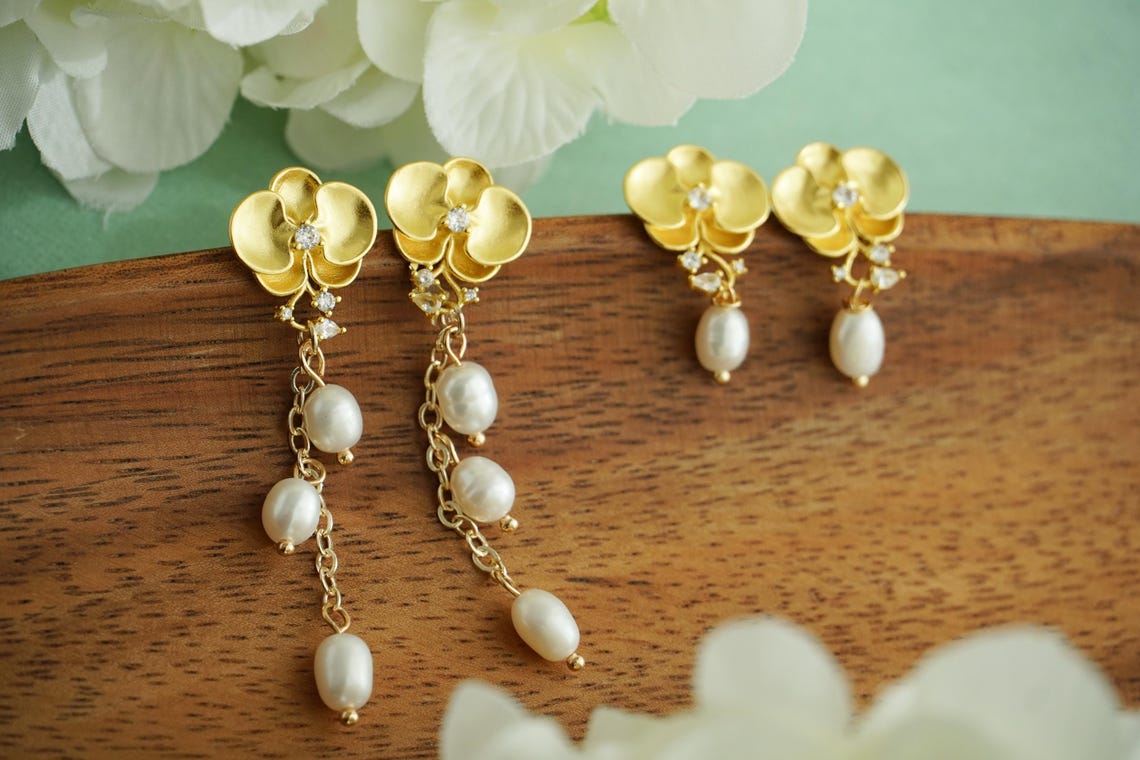 Golden orchid earrings with fresh water pearl drop