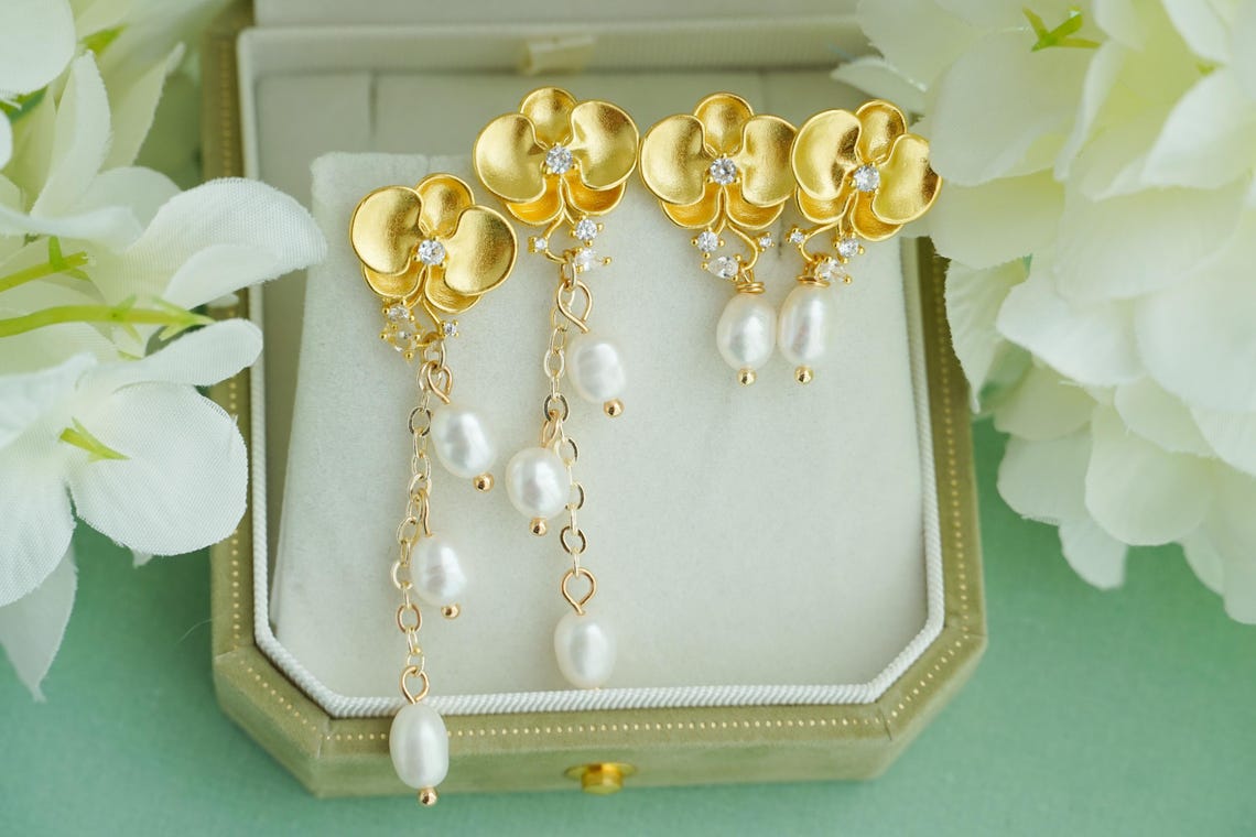 Golden orchid earrings with fresh water pearl drop