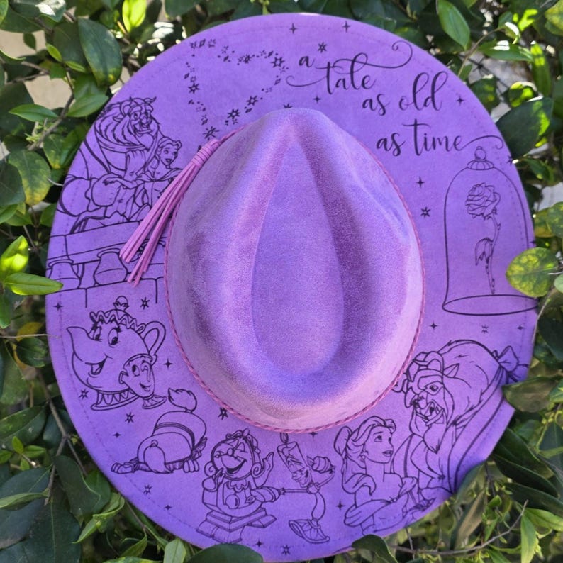 Top-down view of beauty and the Beast engraving Vegan Suede Hat, an engraved western fedora.