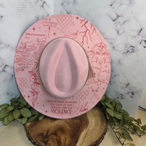 Top-down view of fourth Wing dragon-rider design Wide Brim Hat, a romantasy reader bookish gift.