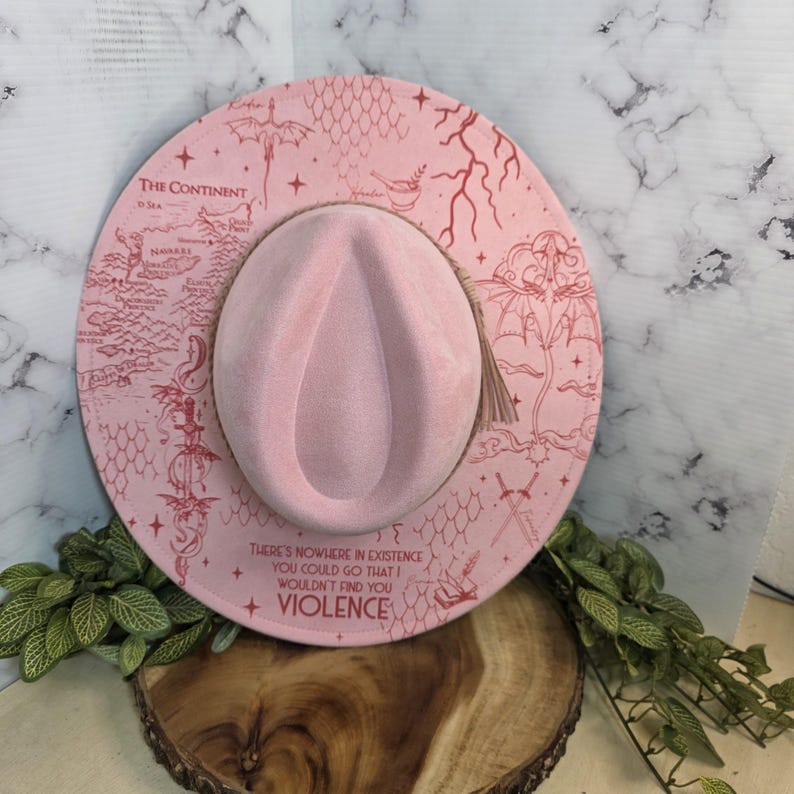 Top-down view of fourth Wing dragon-rider design Wide Brim Hat, a romantasy reader bookish gift.