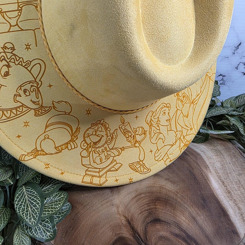 Beauty and the Beast engraving Vegan Suede Hat displayed for gifting, an engraved western fedora.