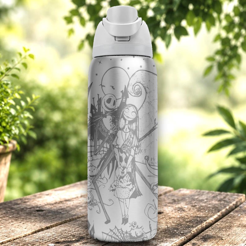 Laser engraved black stainless steel tumbler featuring spooky holiday-inspired characters, pumpkins, haunted scenes, and gothic wraparound artwork in a detailed silver engraving design.