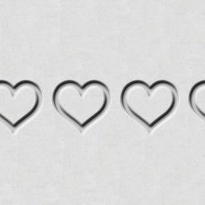 May include: Four white heart shapes are embossed on a gray background. The hearts are evenly spaced and are all the same size.
