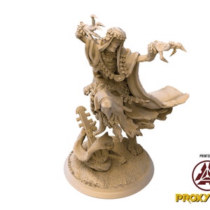 May include: A beige 3D printed miniature of a skeletal figure wearing a robe and holding a musical instrument. The figure has a crab claw for a hand and is standing on a base with a snake and a lyre.