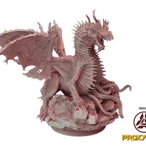 May include: A detailed 3D printed model of a pink dragon with spiky wings and a long, serpentine tail. The dragon is posed in a defensive stance, with its wings spread and its claws extended. The model is printed on a rocky base and features intricate details, including scales, teeth, and claws.