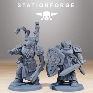 May include: Two grey plastic miniature figures of space warriors. One figure is holding a large sword and shield, the other is holding a gun and a tool. The figures are standing on grey bases. The figures are from the company Stationforge.