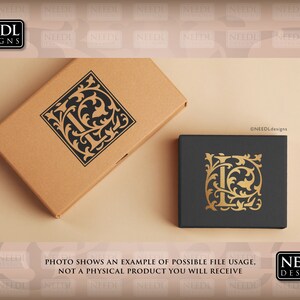 May include: A mockup of a monogram design featuring the letter "L" in a black and gold color scheme. The letter is surrounded by ornate floral details. The design is shown on two boxes, one brown and one black.