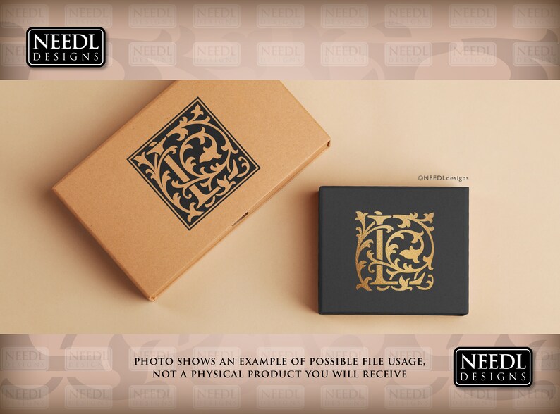 May include: A mockup of a monogram design featuring the letter "L" in a black and gold color scheme. The letter is surrounded by ornate floral details. The design is shown on two boxes, one brown and one black.