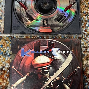 May include: A Killer Instincts video game for Nintendo. The CD case is black, with the game disc inside. The game cover art features a skeleton warrior with a sword and the game title.