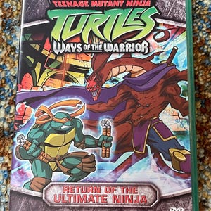 May include: DVD case for "Teenage Mutant Ninja Turtles: Ways of the Warrior." The cover features a green turtle character with orange headwear, holding weapons, and a brown, red, and purple villain. The title "Return of the Ultimate Ninja" is displayed.
