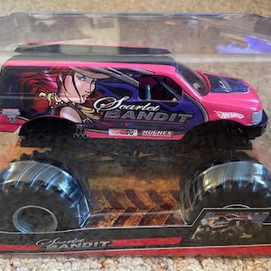 May include: A white ceramic mug with a black handle and the text "But First, Coffee" in a handwritten style. The mug is on a white surface. The mug is approximately 4 inches tall.
