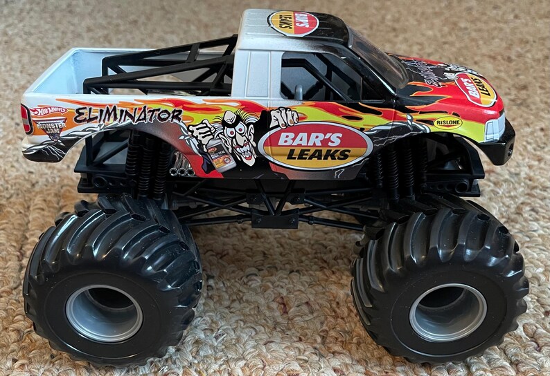 Camión Monster Jam Eliminator Bar's Leaks con carrocería de metal fundido a presión - Escala 1:24 Mattel imagen 5