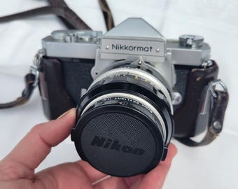 Vintage Nikkormat Nikon 50mm Camera with case. Original packaging and instructions.