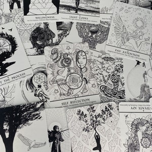 May include: A set of black and white oracle cards with various illustrations and text. The cards feature themes of self-reflection, light codes, willingness, and paying attention. The cards are laid out on a white surface.