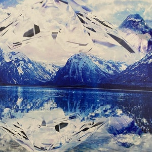 May include: A digital art print featuring a mountain range reflected in a lake. The mountains are covered in snow and the lake is a deep blue. A large, white, crystal-like shape is superimposed over the mountains and lake.