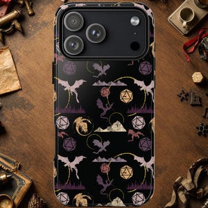 May include: Black phone case with a fantasy-themed pattern. The design features purple dragons, dice, and mountain silhouettes. The case has a glossy finish and a camera module with three lenses.