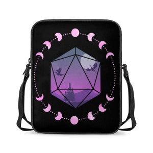 May include: Black laptop bag with a pink and purple design featuring a 20-sided die with a crescent moon and two dragons inside. The die is surrounded by a circle of pink crescent moons.