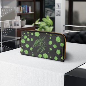 May include: Black leather zippered wallet with a green dragon and dice pattern.