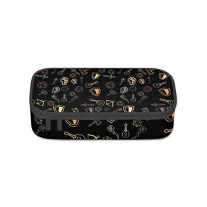 May include: Black pencil case with a repeating pattern of fantasy role-playing game icons in shades of gold, orange, and gray. The pencil case has a black zipper and a gray trim.