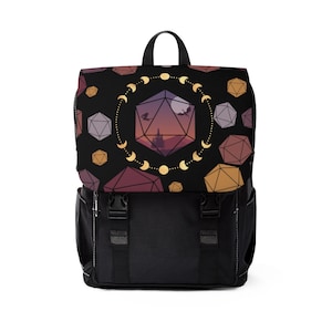 May include: Black backpack with a fantasy design. The flap displays a geometric dice pattern and a landscape with dragons. The main body is black with two front pockets and adjustable straps. A top handle is included.