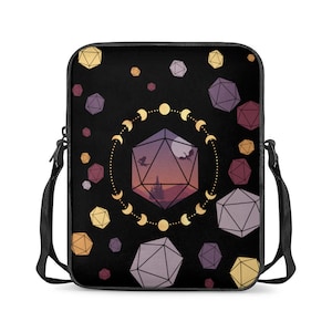 May include: Black laptop bag featuring a repeating pattern of gold and purple dice, a crescent moon design, and a sunset scene within a large die.