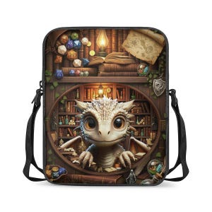 May include: A black crossbody bag with a fantasy design. It shows a white dragon in front of a bookshelf with books, dice, and a map. The bag has a black strap and zip.