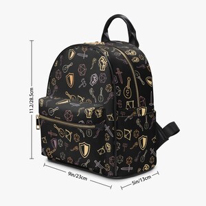 Mini PU leather backpack purse with fantasy RPG icons including dice, swords, shields, and spell symbols on a black background; front zipper pocket and top handle