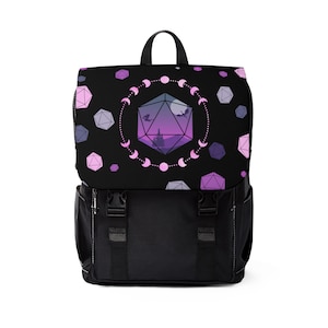 May include: Black backpack with a purple and pink geometric design featuring a large purple and pink dice with a silhouette of a castle and two dragons. The dice is surrounded by a circle of pink moons.
