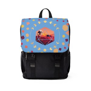 May include: A blue backpack with a black dragon and a red and orange dice design. The backpack has a black strap and a black zipper.