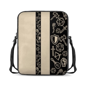 May include: A black and beige laptop sleeve with a vertical black stripe down the centre. The stripe is decorated with a pattern of various fantasy role-playing game icons, including swords, shields, dice, and musical instruments.