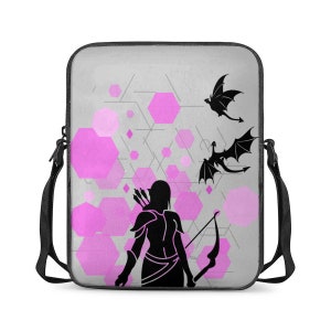 May include: A black and grey laptop sleeve with a pink geometric pattern. A silhouette of a woman with a bow and arrow is in the centre of the design. Two black silhouettes of dragons are in the top right corner of the design.