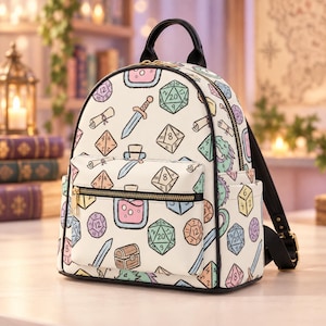 May include: A cream-colored backpack featuring a repeating pattern of colorful fantasy illustrations including polyhedral dice, swords, potion bottles, scrolls, treasure chests, and dragon heads. The bag has black trim, a top handle, and gold zippers.