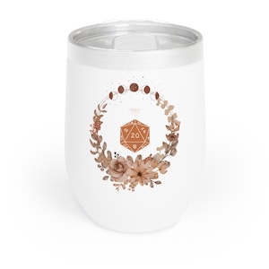 May include: White stainless steel tumbler with a brown 20-sided die surrounded by a floral wreath and a crescent moon design.