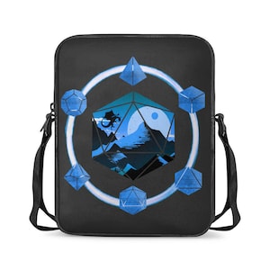 May include: A black laptop bag with a blue and white design featuring a stylised image of a mountain landscape inside a large blue dice. The dice is surrounded by smaller blue dice in a circle.