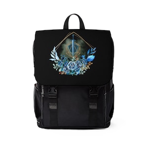 May include: Black backpack with a floral design featuring blue flowers and a gold geometric frame with a sword and a blue and gold dice inside.
