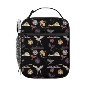 May include: Black lunch bag with a repeating pattern of dragons, dice, and mountain silhouettes in shades of gold, purple, and cream. The bag has a black handle, a mesh side pocket, and a zipper pocket. Silverware is visible in the side pocket.