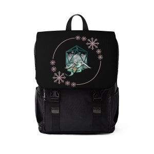 May include: Black backpack with a flap closure and two front pockets. The flap features a circular design with a green dragon, snowflakes, and a geometric shape. The backpack has a top handle and adjustable straps.