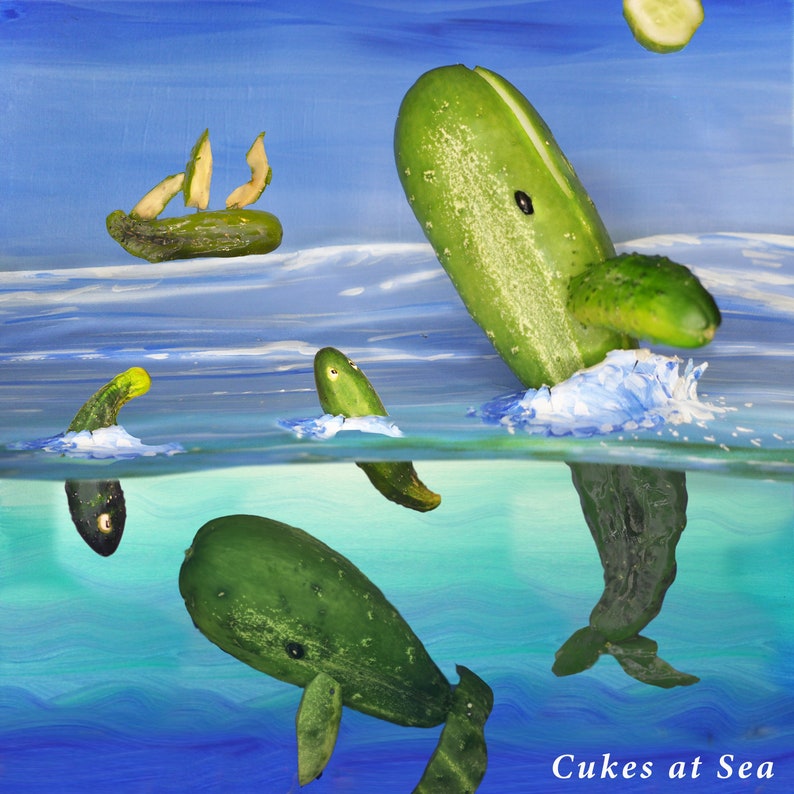 May include: A whimsical painting of cucumbers arranged to look like whales swimming in the ocean. The painting is titled "Cukes at Sea".