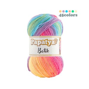 May include: A vibrant ball of Papaya Batik yarn, displaying a gradient of rainbow colours. The yarn is labelled with the brand name and the text "45 colours" is displayed above the yarn.