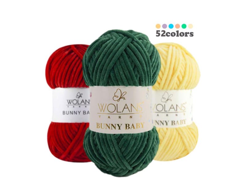 May include: Three skeins of yarn in red, green, and yellow. The yarn is soft and fluffy, and it is labeled "Bunny Baby" and "Wolans Yarn". 52 colors are available.