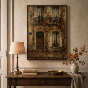 Old stone house covered in autumn ivy art print beside a warm lamp — vintage architectural fall decor printable from a Halloween and autumn bundle download.