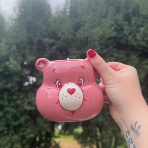 black raspberry & vanilla scented candle in a cute care bear mug