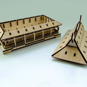 May include: A wooden model of a Japanese-style house with a removable roof. The model is made of light brown wood and has a detailed design. The roof is made of a series of small, overlapping pieces of wood.