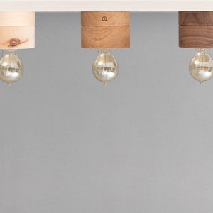 Dimmable ceiling light made of oak wood in Scandinavian design. Handmade wooden ceiling lamp for living room, bedroom and hallway