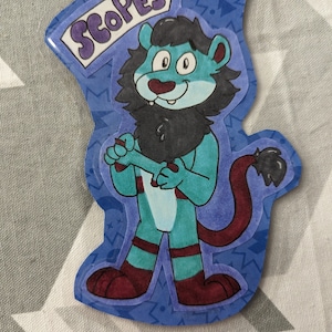 May include: A blue lion character with a black mane and red tail, wearing a blue and red outfit. The character is standing on a blue background with a white banner that says "SCOPES".
