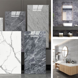 Może przedstawiać: Pięć różnych próbek płytek marmurowych wyświetlanych na ścianie. Płytki są w różnych odcieniach szarości i bieli. Płytki są ułożone w pionowym rzędzie. Płytki są wszystkie prostokątne.