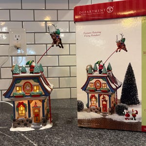 Dept 56:  Santa&#39;s Reindeer Rides, North Pole Series, Lighted House, Village House, Holiday House, Village Decor, Holiday Decor