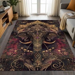 May include: A rectangular area rug featuring an ornate elephant design in shades of black, gold, and burgundy. The elephant is the central focus, adorned with intricate patterns and jewel-toned accents. The rug's design includes floral and geometric elements.